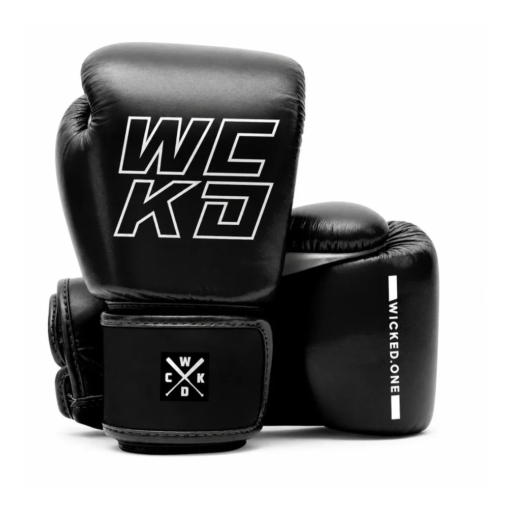 A pair of black leather boxing gloves with white branding, including 'WCKD' on the front glove and 'WICKED ONE' on the side, set against a plain white background.