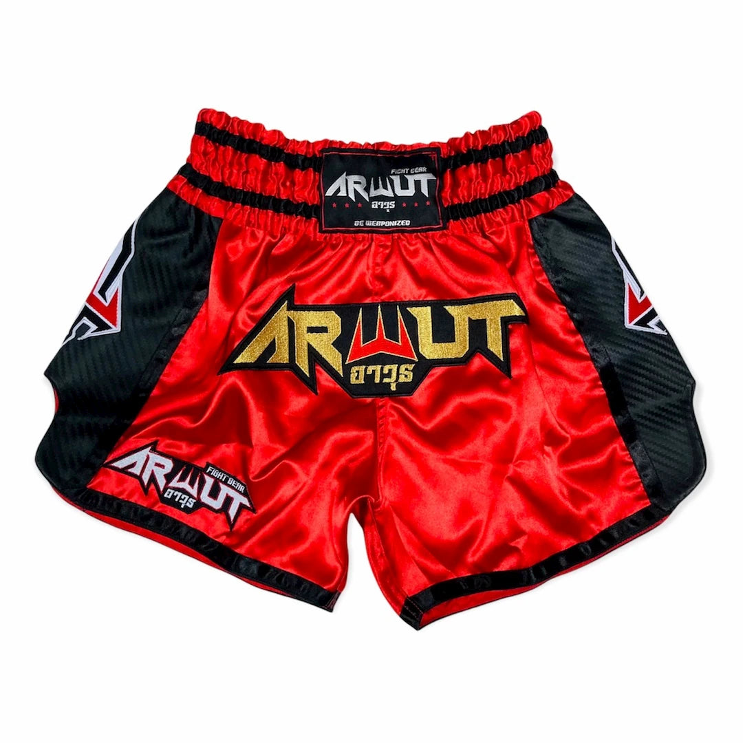 Red and black Muay Thai shorts with 'Arwut' branding on a white background