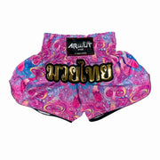 Colorful Muay Thai shorts with a golden Arwut brand label on a white background