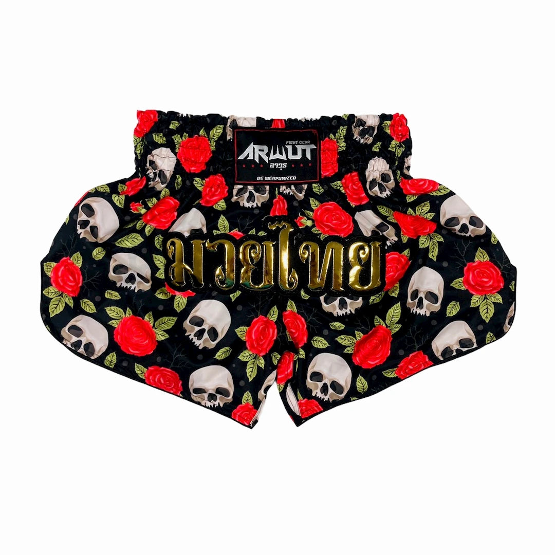Muay Thai shorts with skull and rose pattern on a white background