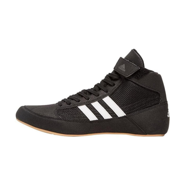 Black Adidas athletic shoe with white stripes on a white background