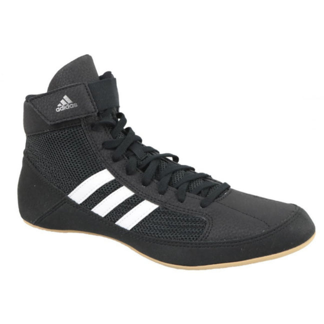 Black Adidas sneaker with white stripes on a white background