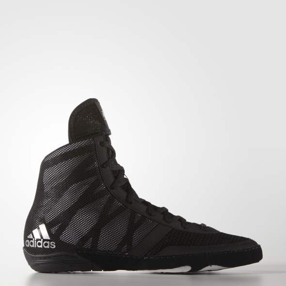 Black Adidas athletic shoe on a white background
