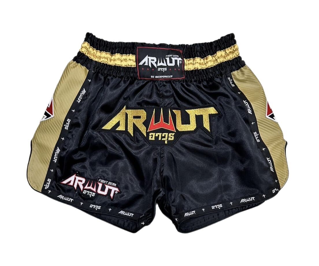 Black and gold Muay Thai shorts with 'Arwut' branding on a white background