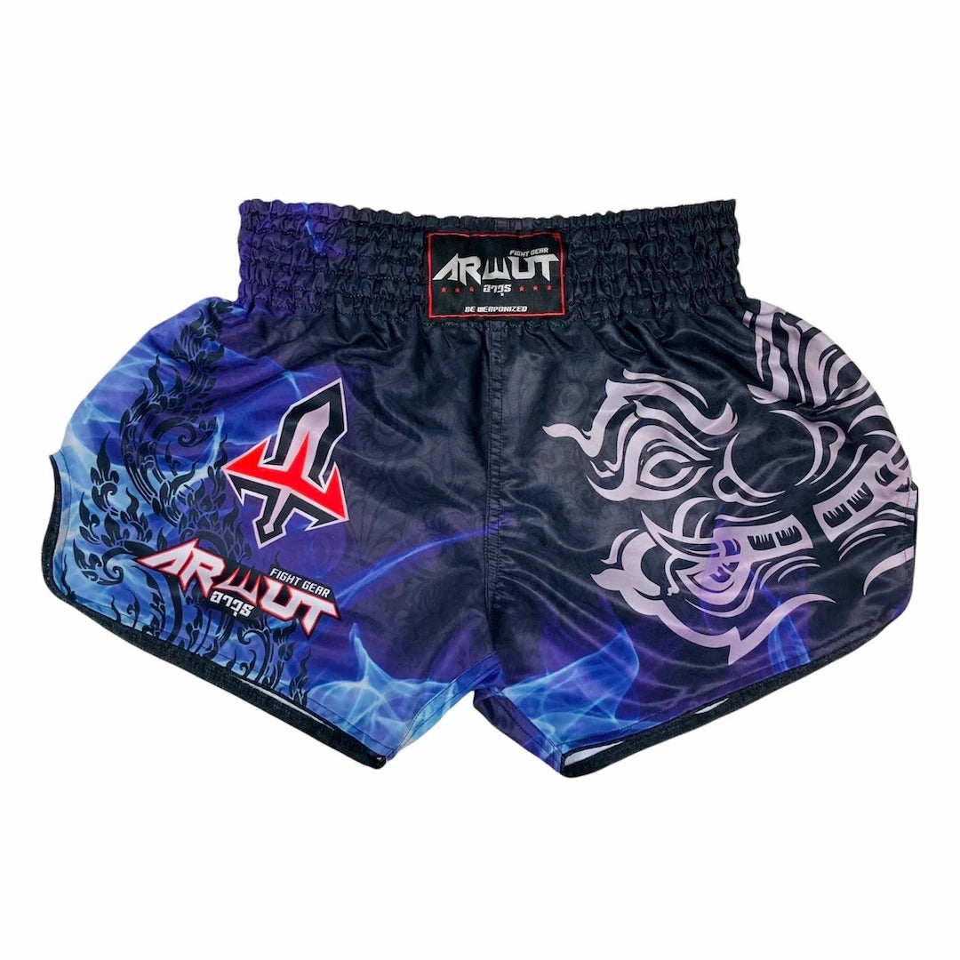 Black and blue Muay Thai shorts with a brand logo on a white background