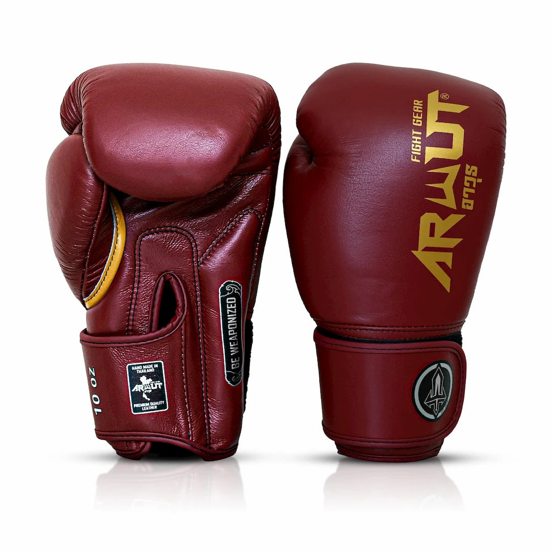 Pair of maroon boxing gloves with 'Arwut' branding on a white background