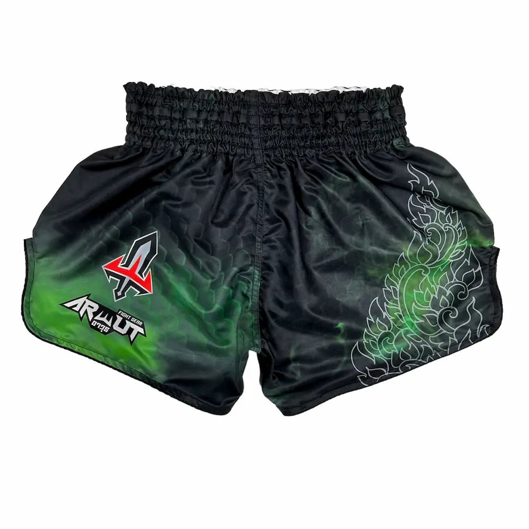 Black and green Muay Thai shorts with a brand logo on a white background