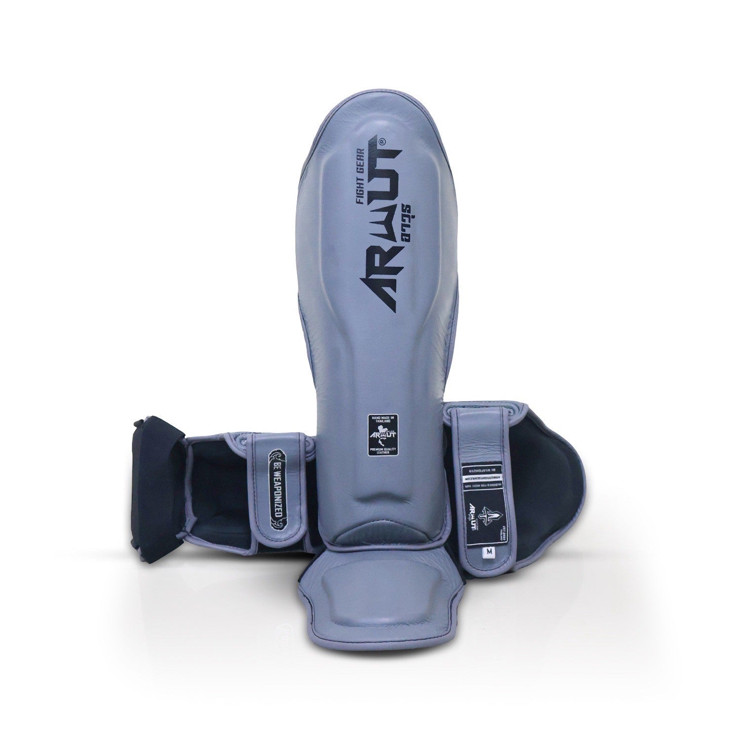 Gray shin guards with 'Arnut' branding on a white background