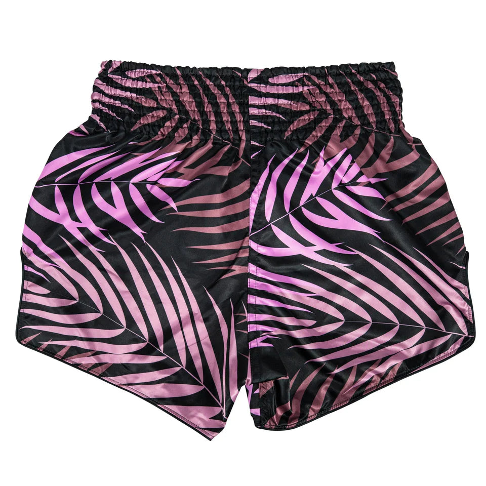 Pink and black patterned Muay Thai shorts on a white background
