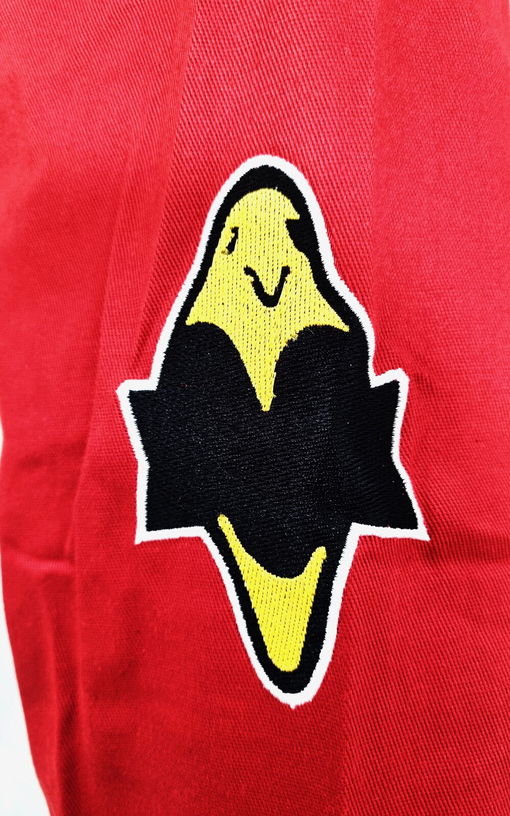 Yellow ghost with black outline on a red background