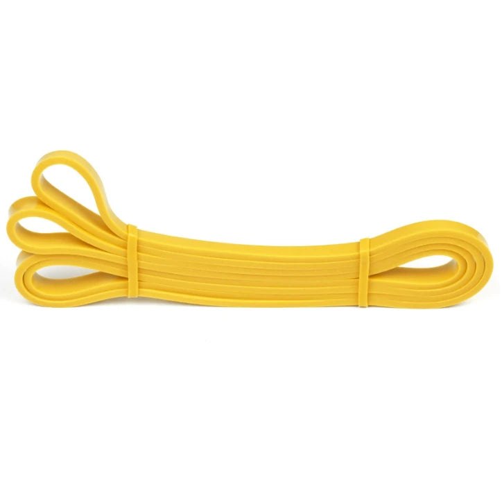 Yellow rubber band on a white background