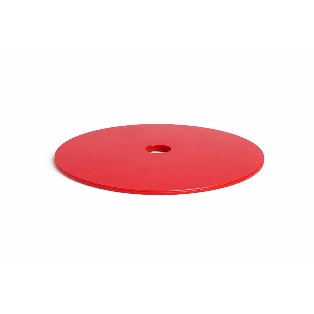 Red circular object with a central hole on a white background