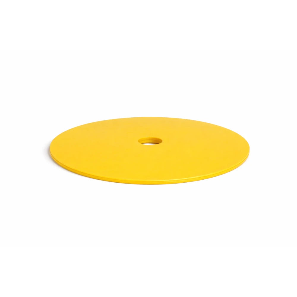 Yellow circular object with a central hole on a white background