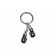 Metallic boxing glove keychain on a white background