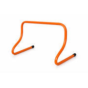 Orange plastic hurdle on a white background