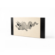 Rectangular punching targett with black dragon design on a beige background