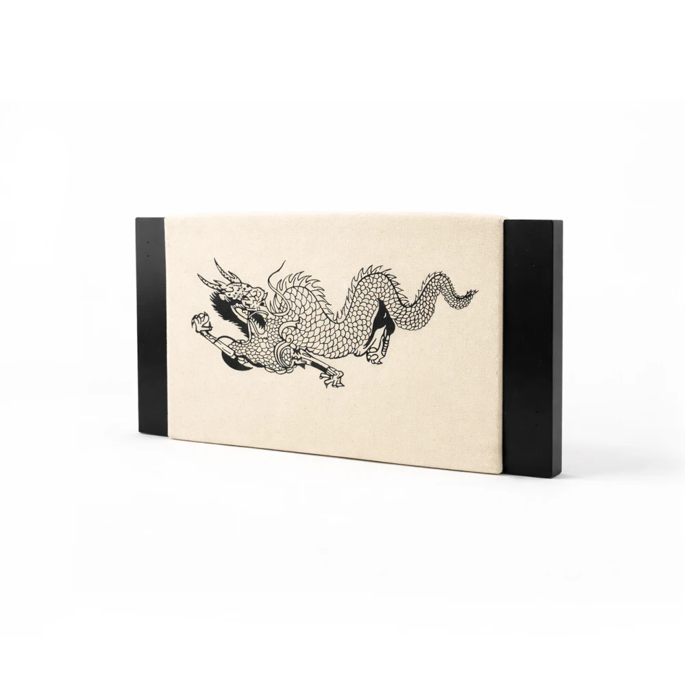 Rectangular punching targett with black dragon design on a beige background