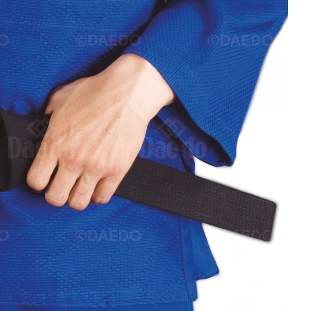 Person wearing a blue martial arts uniform with a black belt.