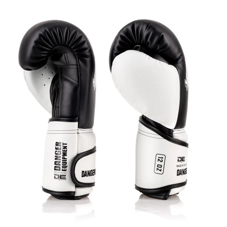 Pair of black and white boxing gloves on a white background