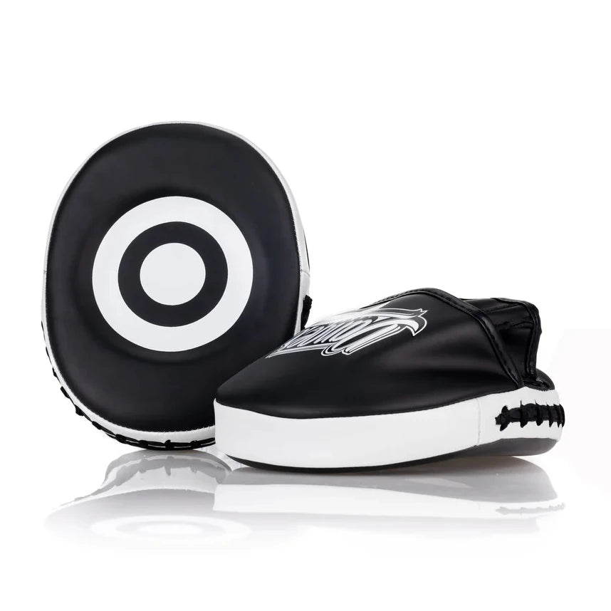 Black and white focus mitts with a target design on a white background