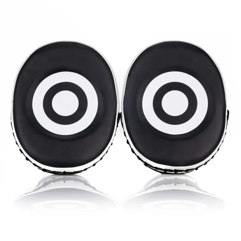 Two black and white target-like objects on a white background