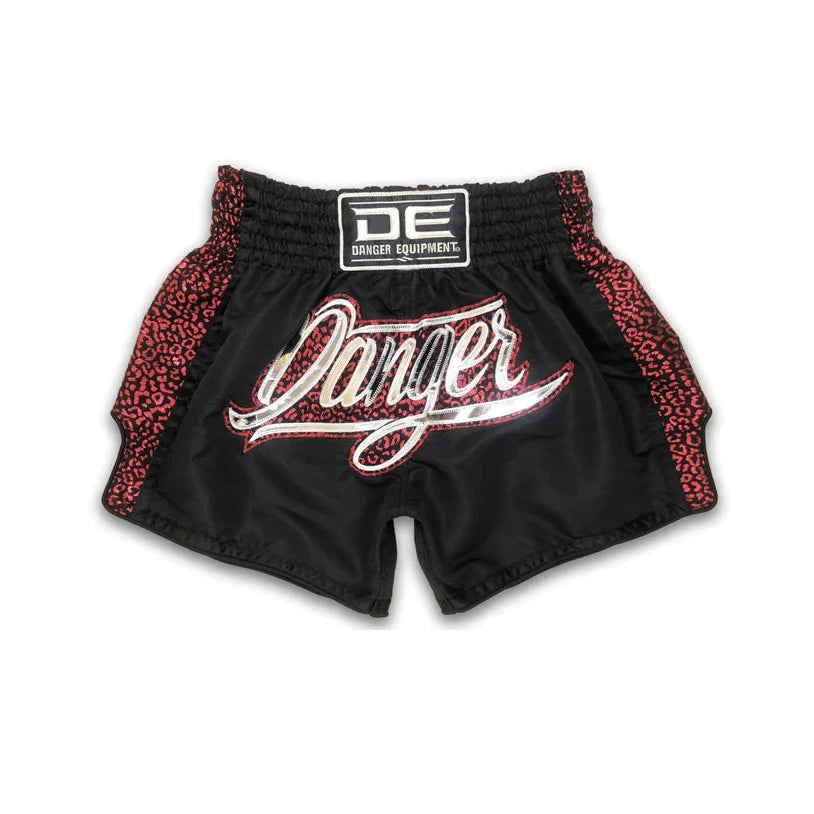Black thai shorts with red leopard print accents and 'Danger' branding on a white background