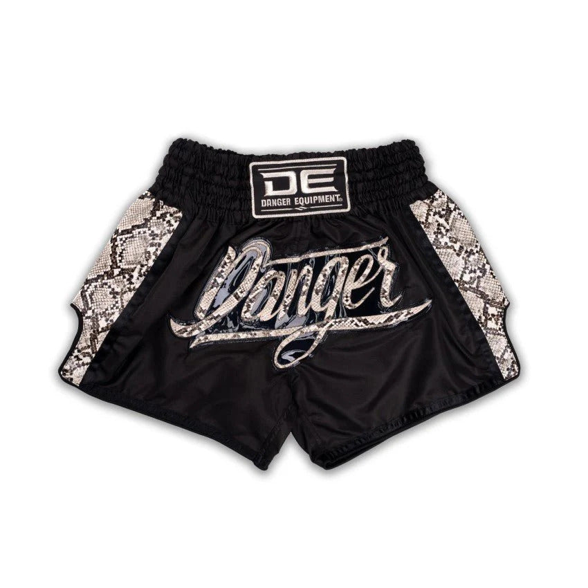 Black shorts with snake print trim and 'Danger' branding on a white background