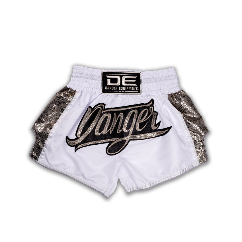 White boxing shorts with gold accents and 'Danger' text on a white background