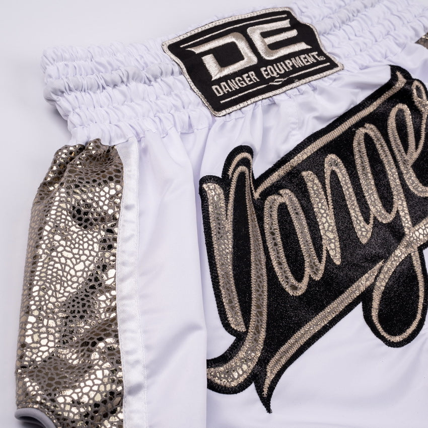 White shorts with 'DE' Danger Equipment logo and decorative text on a white background