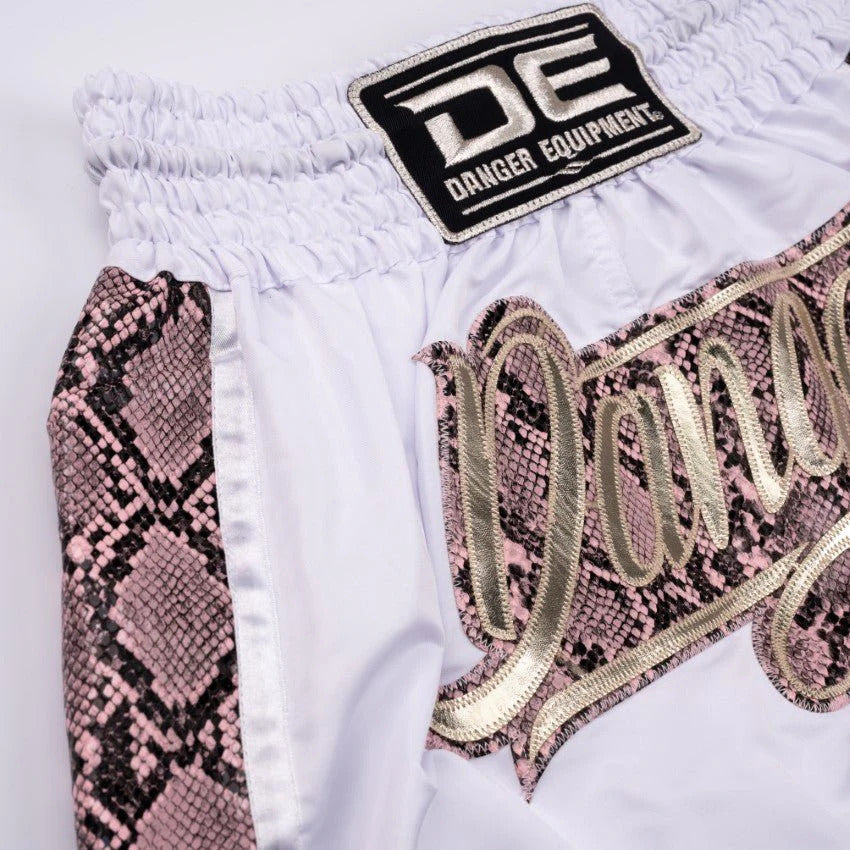 White shorts with pink snake print accents and 'Danger Equipment' logo.