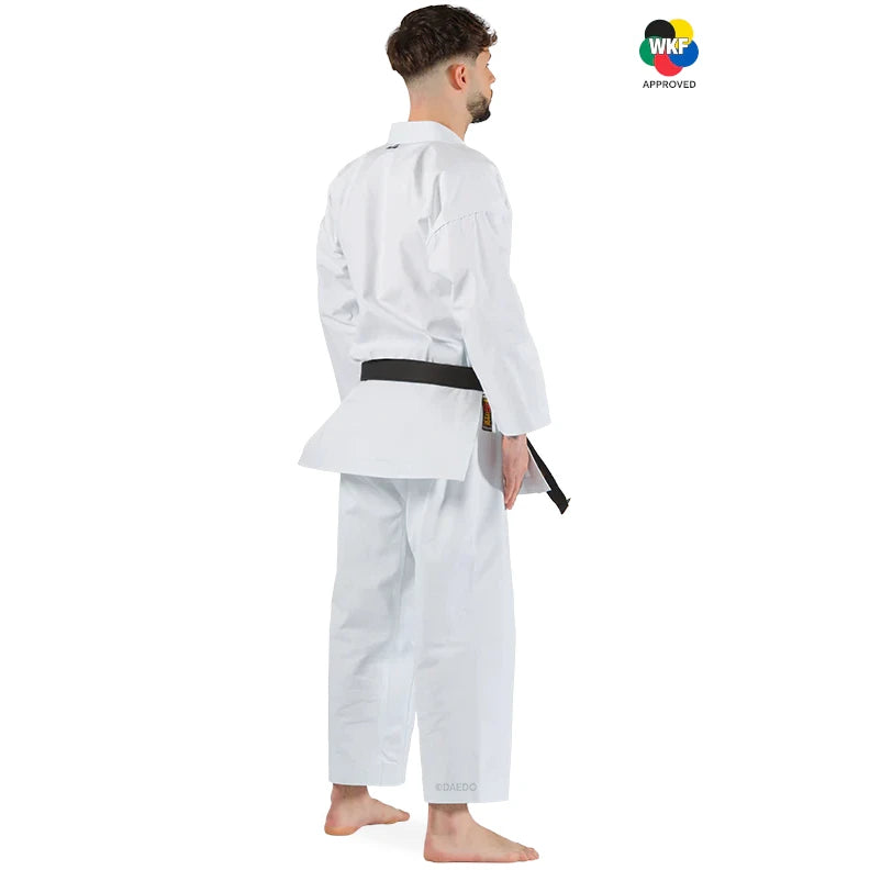 Male wearing a white martial arts uniform with a black belt on a white background, featuring WKF approval logo.