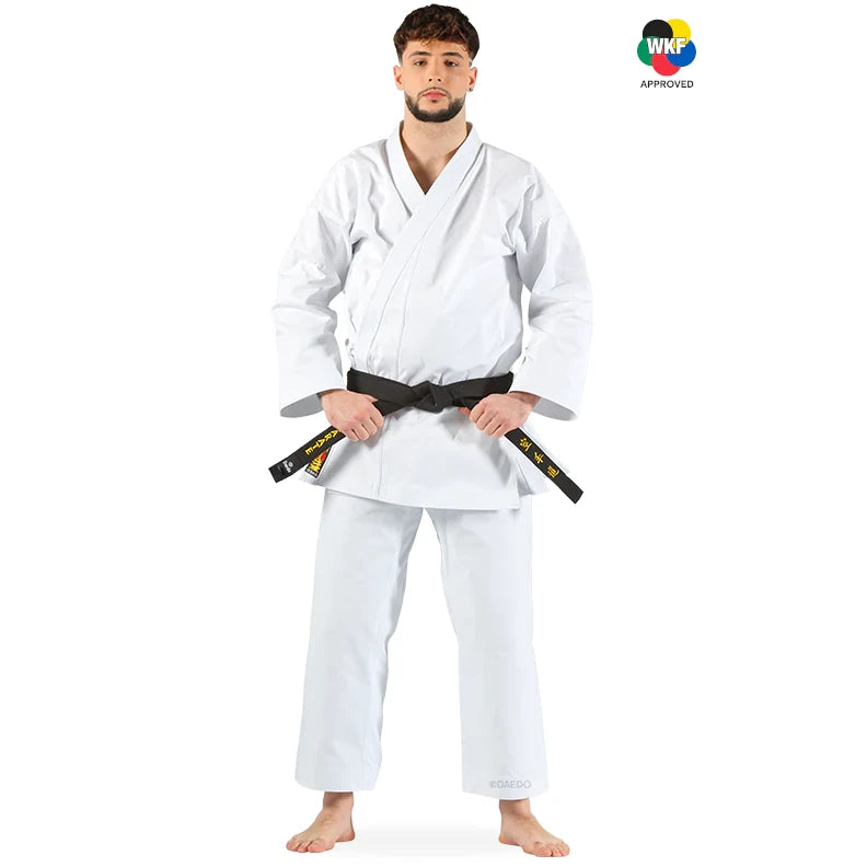 Male wearing a white martial arts uniform with a black belt on a white background, featuring WKF approval logo.