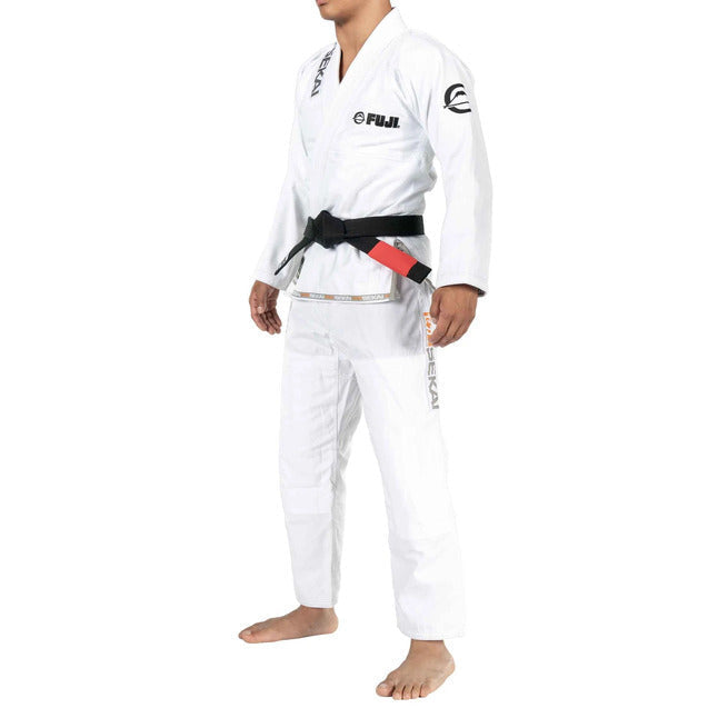 Male wearing a white Fuji BJJ gi with black belt on a white background
