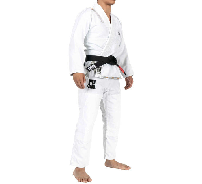 Male wearing a white Fuji martial arts gi with a black belt on a white background