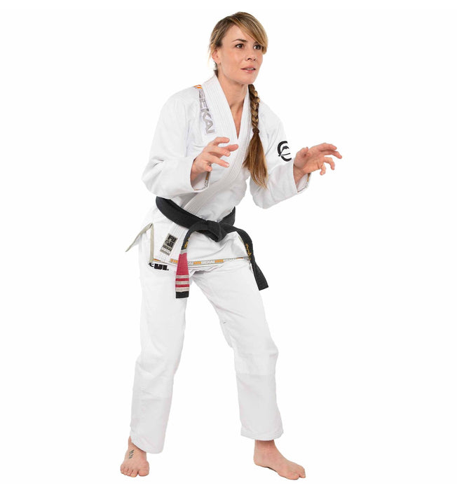 Female wearing a white Fuji martial arts uniform with a black belt on a white background