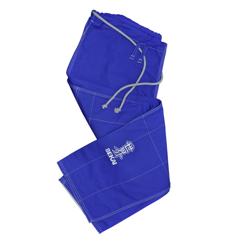 Folded blue gi pants with a Fuji brand logo on a white background