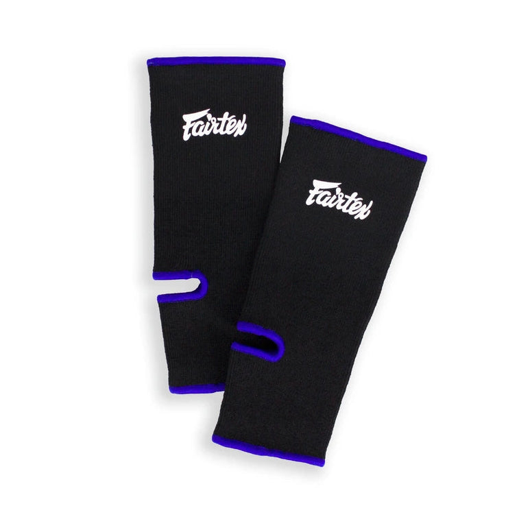Pair of black ankle guards with blue accents on a white background