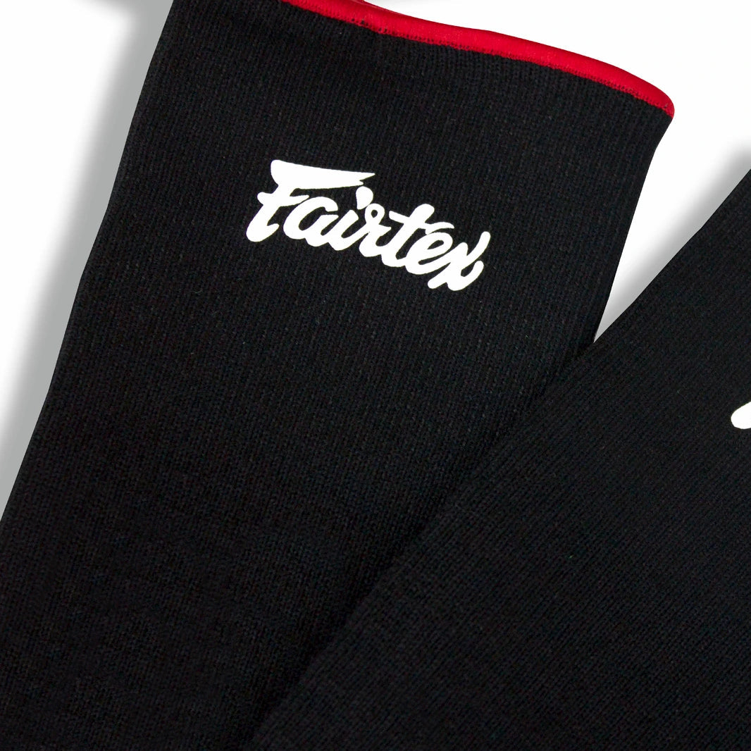 Black ankle sleeves with 'Fairtex' branding on a white background