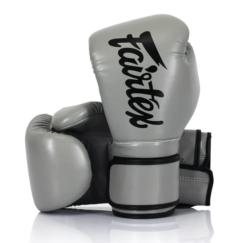 Gray boxing gloves with black 'Fairtex' logo on a white background
