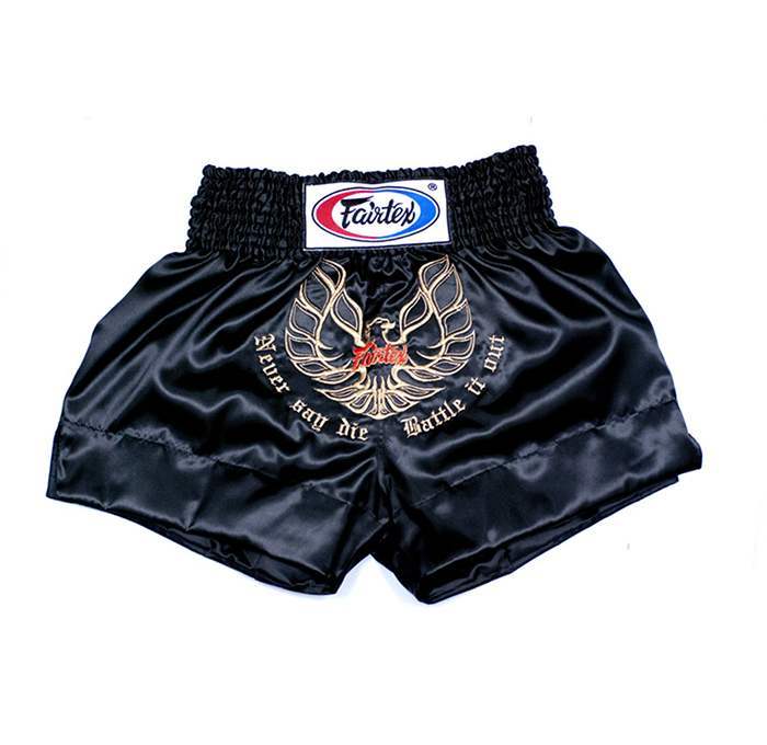 Black Muay Thai shorts with Fairtex logo and text on a white background