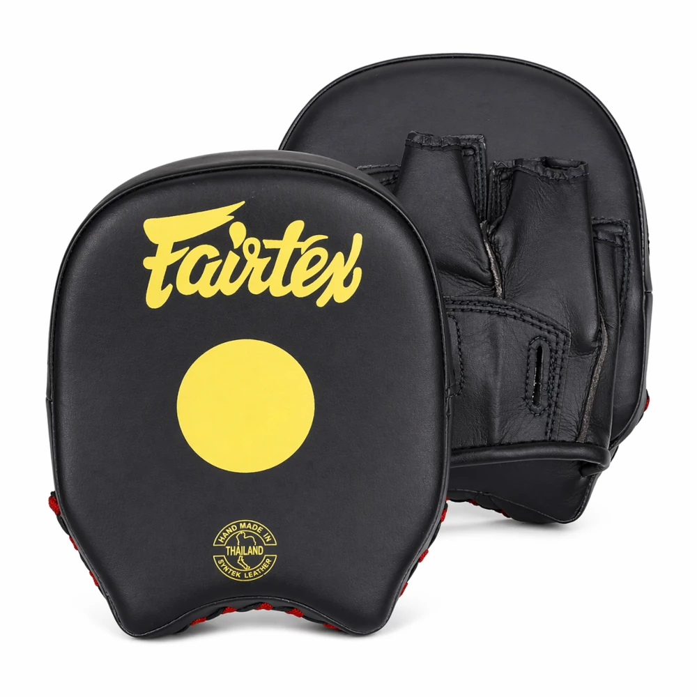 Black and yellow Fairtex boxing mitts on a white background