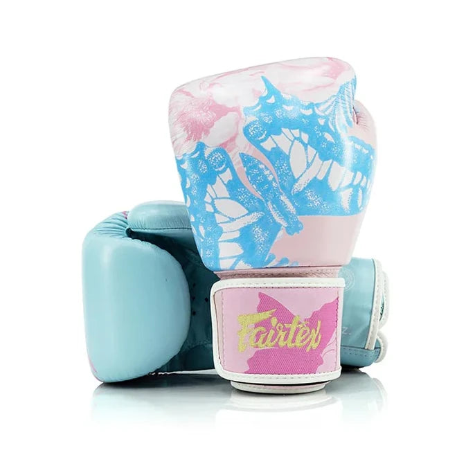 Pair of pastel-colored Fairtex boxing gloves with a visible brand logo on a white background