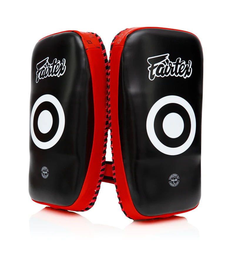 Black and red Muay Thai pads with white targets on a white background