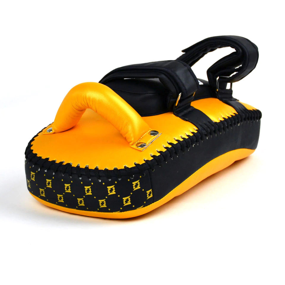 Black and yellow Muay Thai pad on a white background