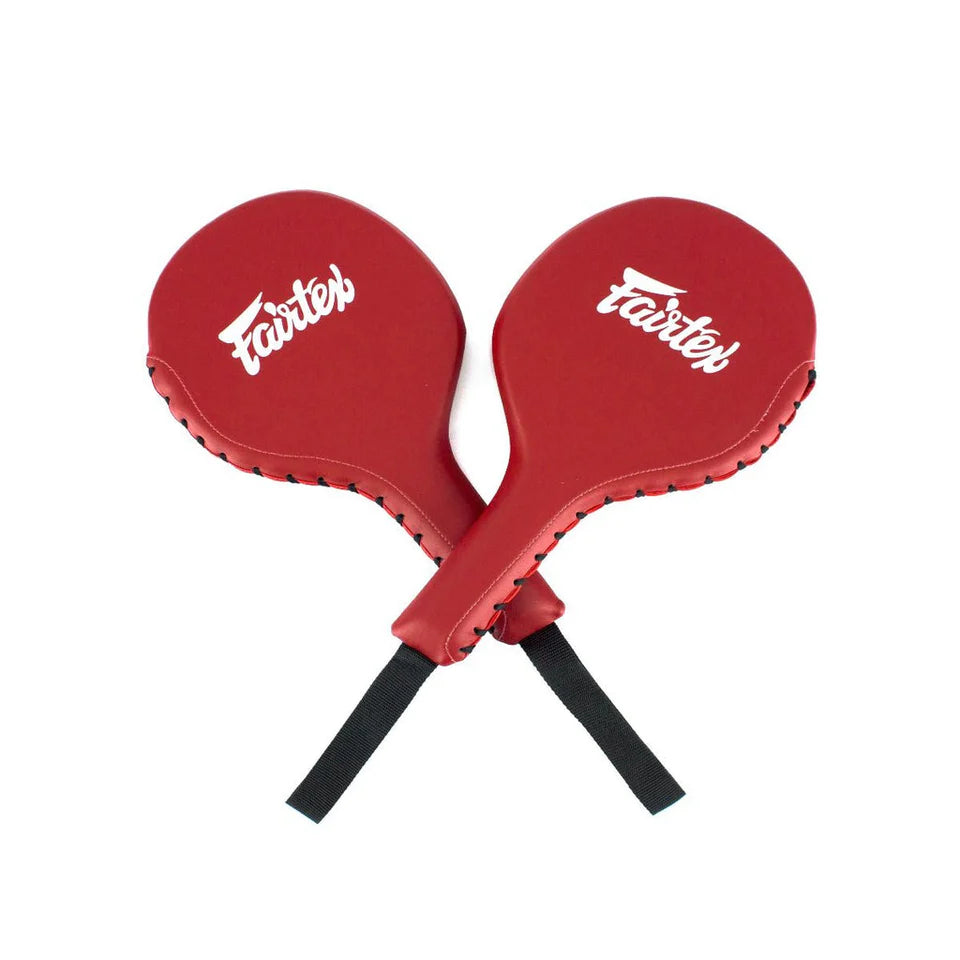 Two red boxing paddles with 'Fairtex' branding on a white background