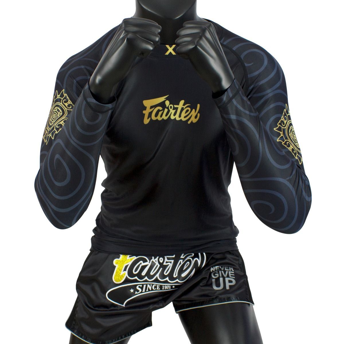 Black and gold rash guard with 'Fairtex' branding on a mannequin against a white background