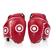 Pair of red Muay Thai thigh pads with white circular designs on a white background