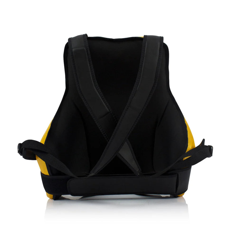 Inside view of a black and yellow Muay Thai body protector on a white background
