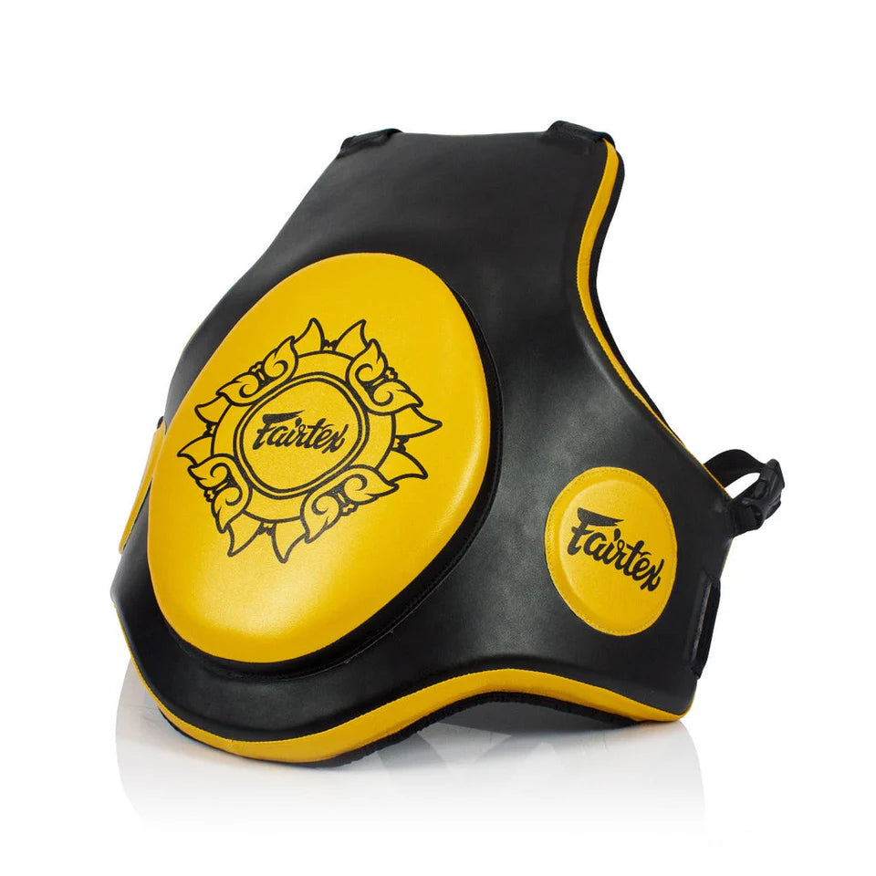 Black and yellow Muay Thai body protector with Fairtex logo on a white background