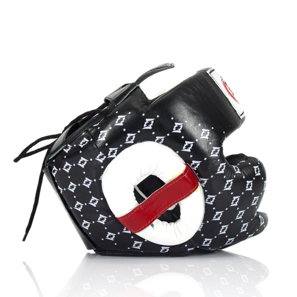Side profile of a black boxing headgear with white pattern and red accents on a white background
